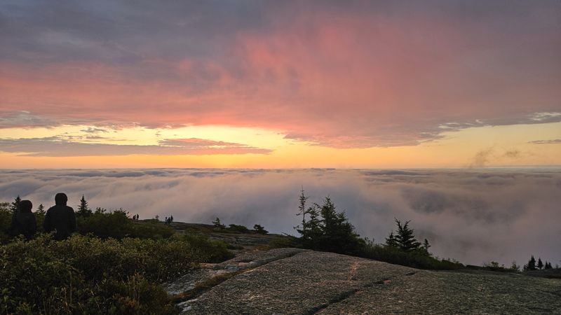 Pink sunrise over a sea of clouds